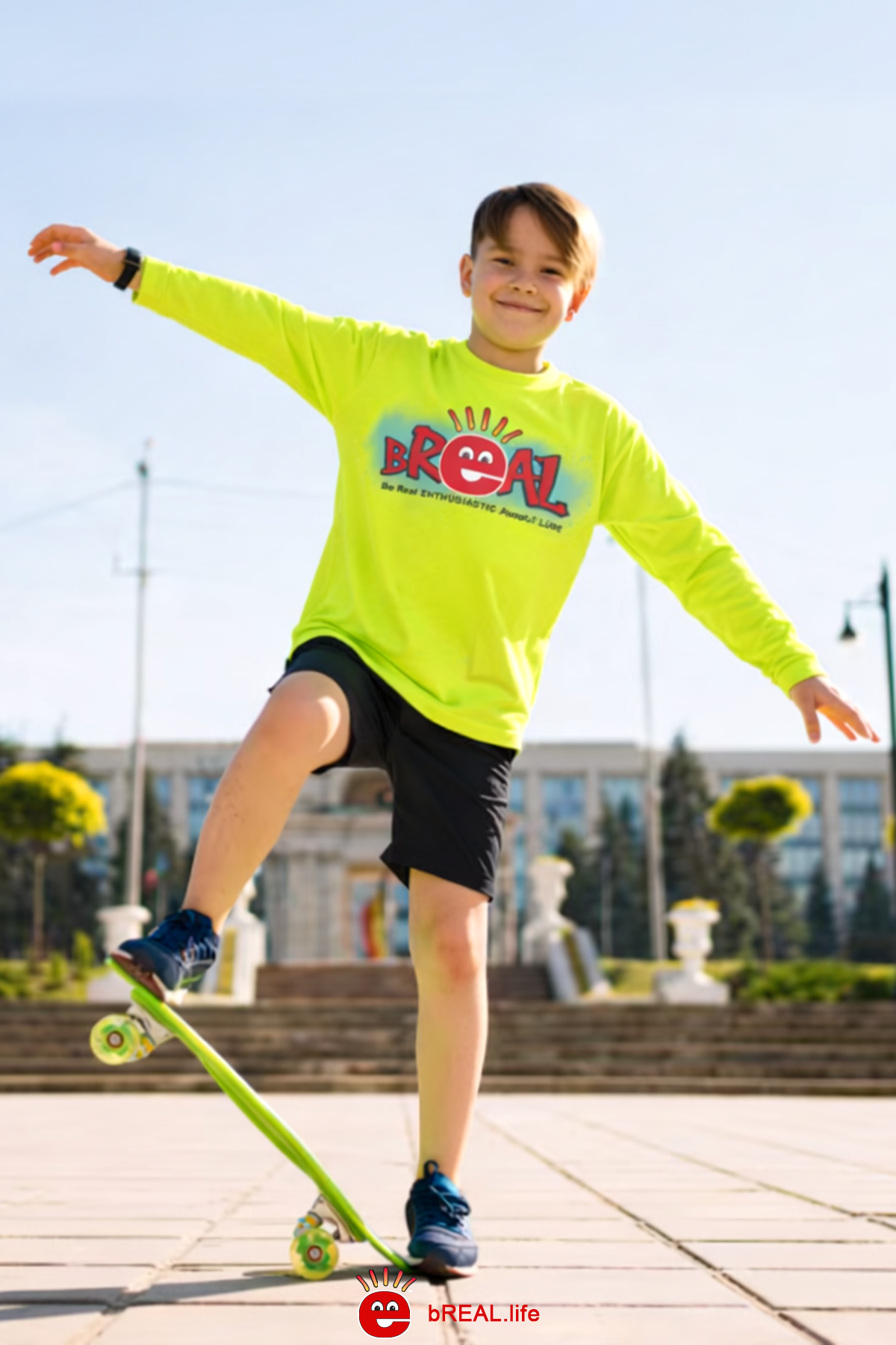 Child in a bright yellow shirt with 'bReal' logo on a skateboard outdoors.